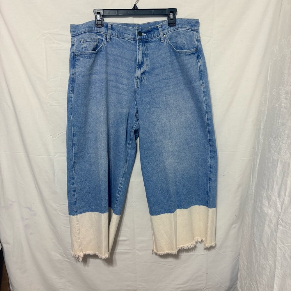 a.n.a high-rise, wide-leg crop jeans with a light wash and white cuffs.